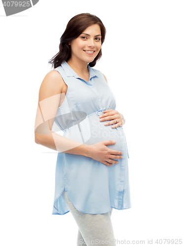 Image of happy pregnant woman touching her big belly