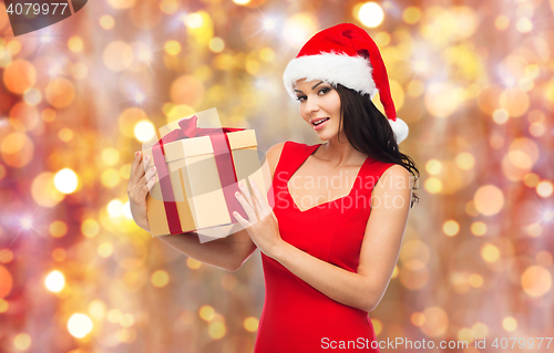 Image of beautiful sexy woman in santa hat with gift box