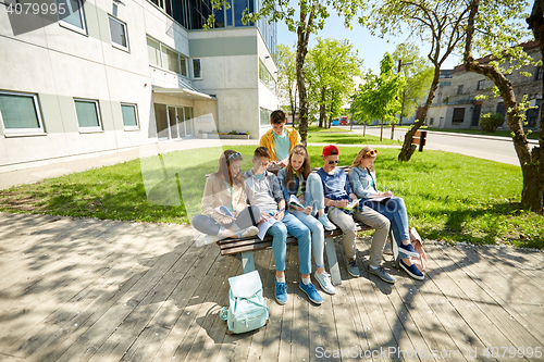 Image of group of students with notebooks at school yard