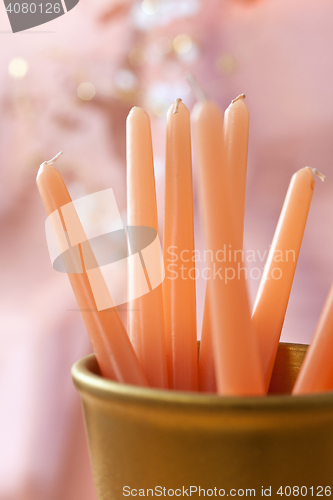 Image of new candles in a vase