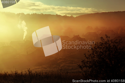 Image of sunrise with fog in countryside