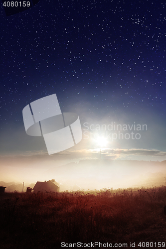 Image of starry heavens over countryside