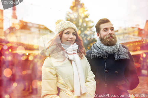 Image of happy couple walking in old town