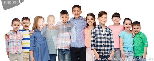 Image of group of happy smiling children hugging over white