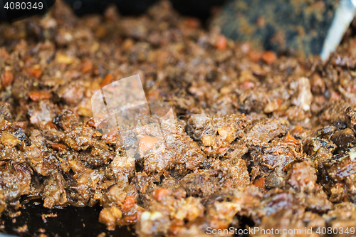 Image of close up of meat wok dish at street market