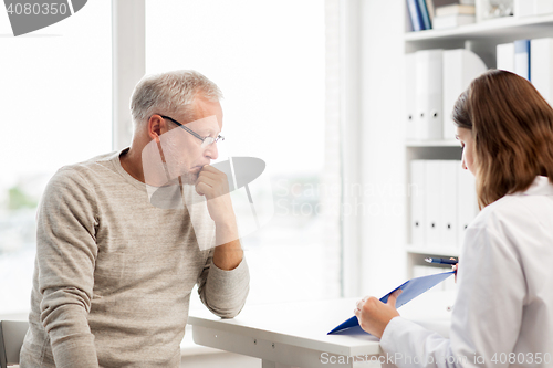 Image of senior man and doctor meeting at hospital