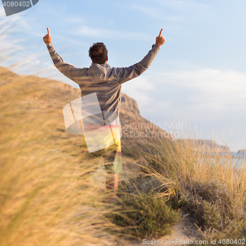 Image of Free active man enjoying beauty of nature.