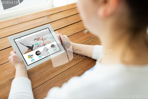 Image of close up of woman with internet shop on tablet pc