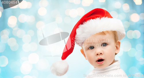 Image of beautiful little baby boy in christmas santa hat
