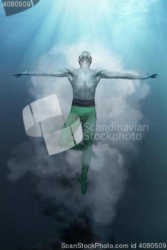 Image of Young and stylish modern ballet dancer on fantasy background