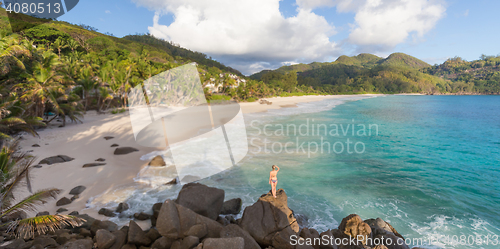 Image of Woman on summer vacations on tropical beach of Mahe Island, Seychelles.