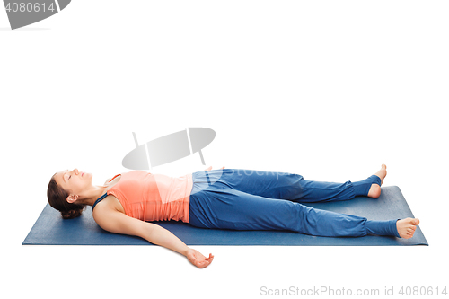 Image of Women relaxes in yoga asana Savasana