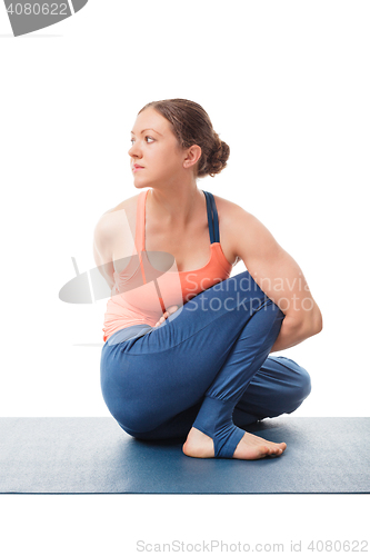 Image of Woman doing Ashtanga Vinyasa Yoga asana Marichyasana D