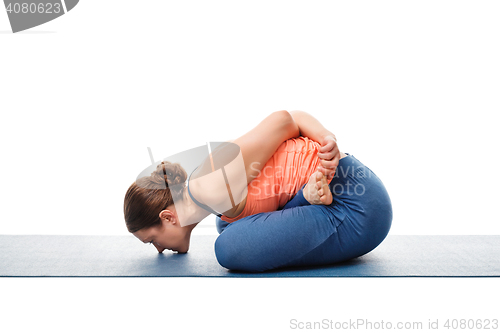 Image of Woman doing asana Yoga mudrasana