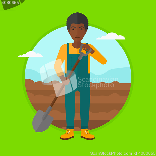 Image of Farmer on the field with shovel.