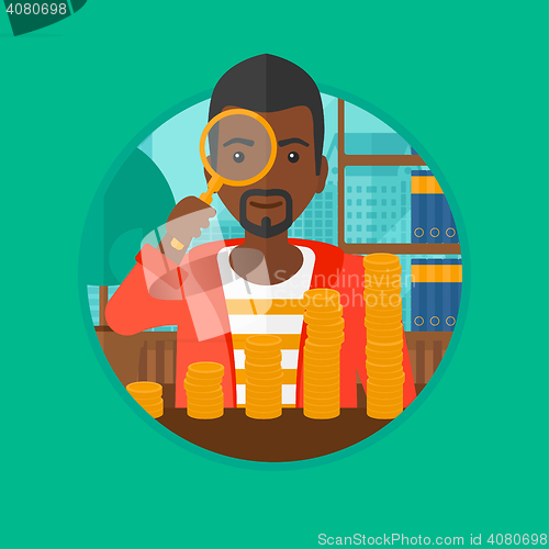 Image of Man looking through magnifier at gold coins.