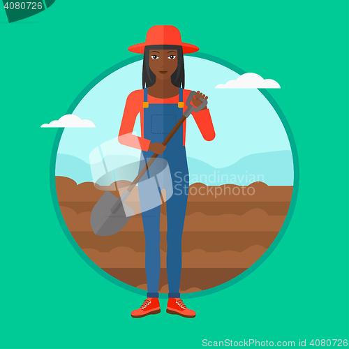 Image of Farmer on the field with shovel.