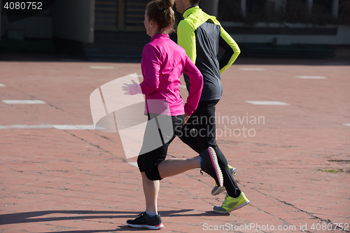 Image of young  couple jogging