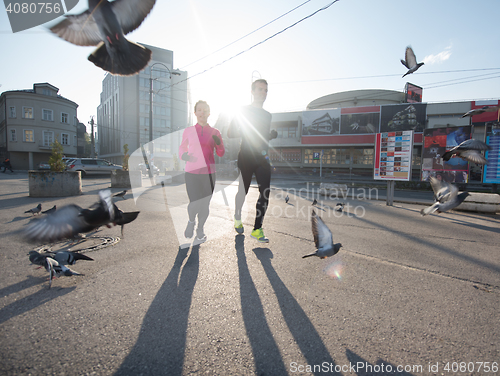 Image of young  couple jogging