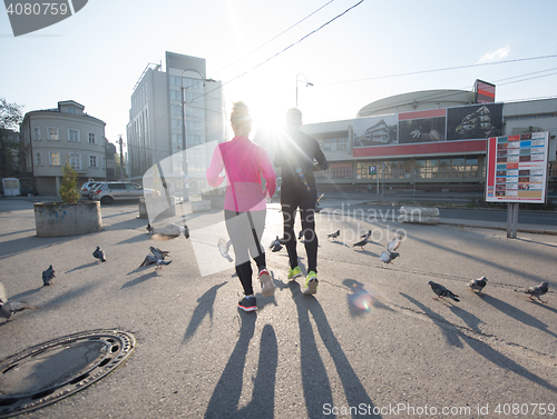 Image of young  couple jogging