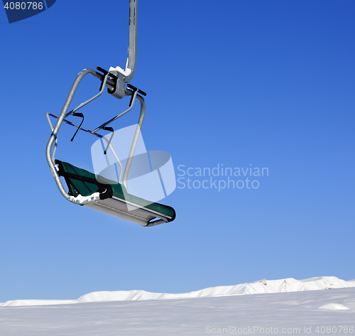 Image of Chair-lift in ski resort at sun day