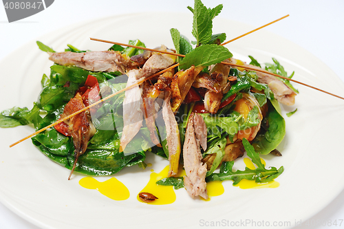 Image of Pumpkin salad with crispy duck and greens