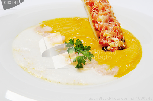 Image of pumpkin cream soup with prawns