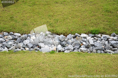 Image of Stone and green grass