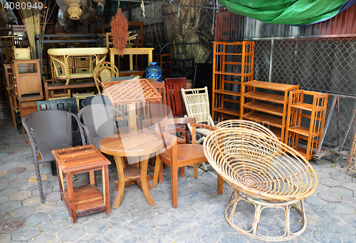 Image of Wooden furniture outside their shop