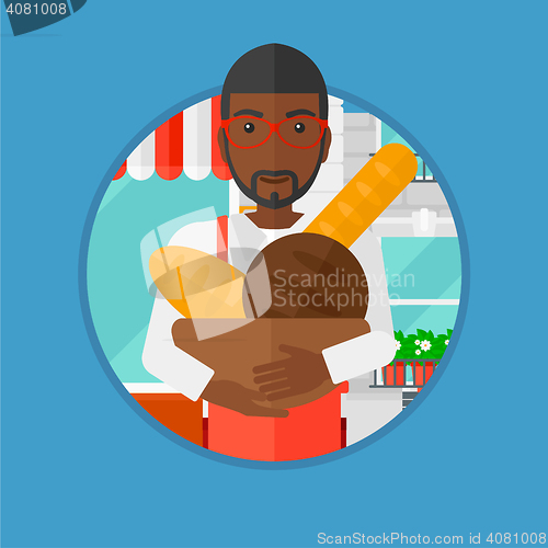 Image of Baker holding basket with bakery products.