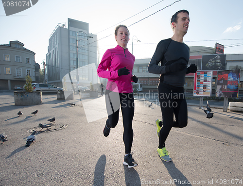 Image of young  couple jogging