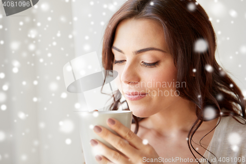 Image of close up of woman with tea cup or coffee