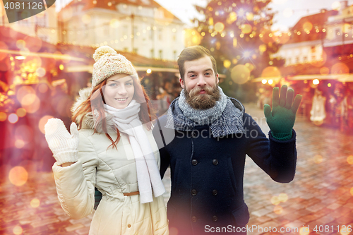 Image of happy couple walking in old town