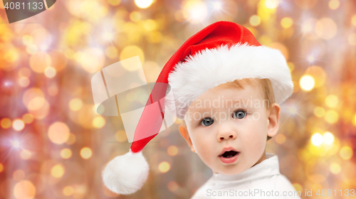 Image of beautiful little baby boy in christmas santa hat