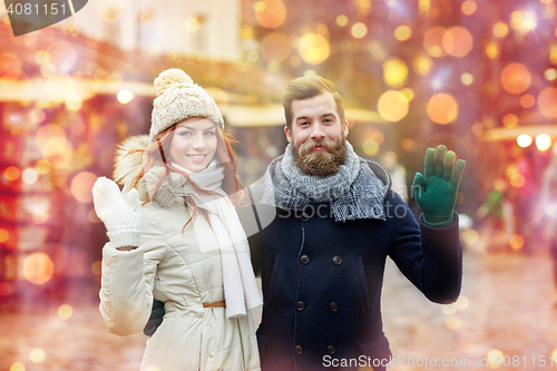 Image of happy couple walking in old town