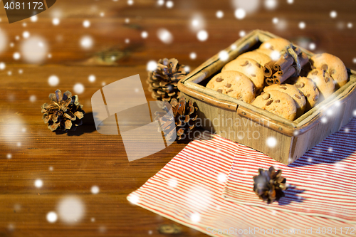 Image of close up of christmas oat cookies on wooden table