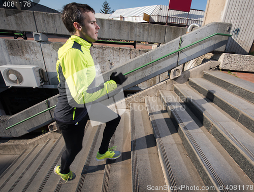 Image of man jogging on steps