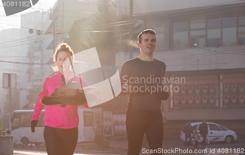 Image of young  couple jogging