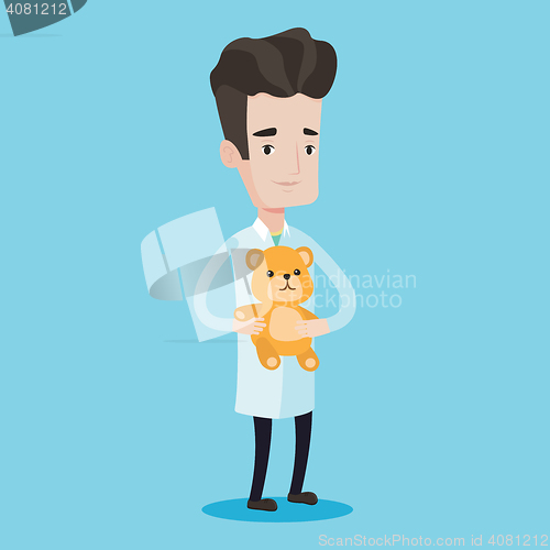 Image of Pediatrician doctor holding teddy bear.