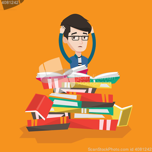 Image of Student sitting in huge pile of books.