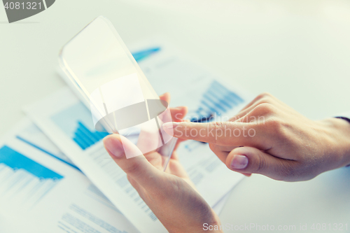 Image of close up of woman with transparent smartphone