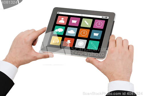 Image of close up of hands holding tablet pc with app icons