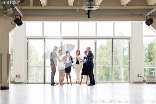 Image of business people with tablet pc computers at office