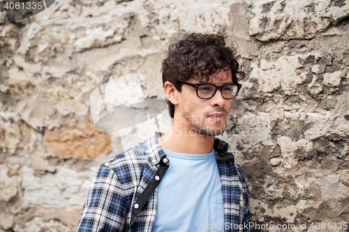 Image of man in eyeglasses on city street