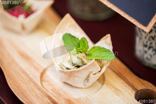 Image of close up of dough cornet with filling