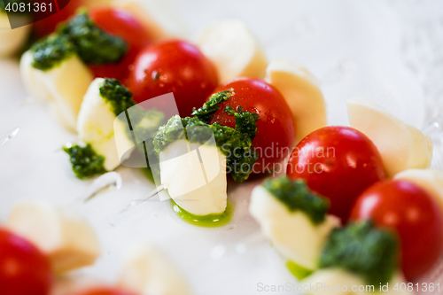 Image of close up of mozzarella and cherry tomato canape