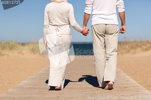 Image of close up of senior couple on summer beach