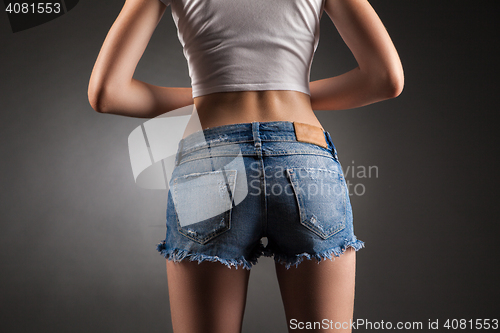 Image of Sexy butt in denim shorts.