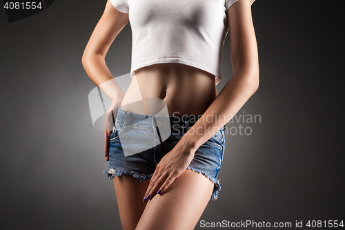 Image of Slim girl posing faceless.