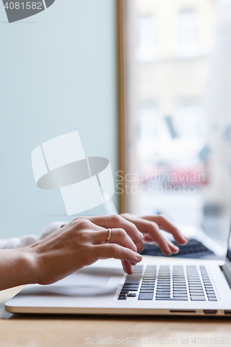 Image of Woman typing text